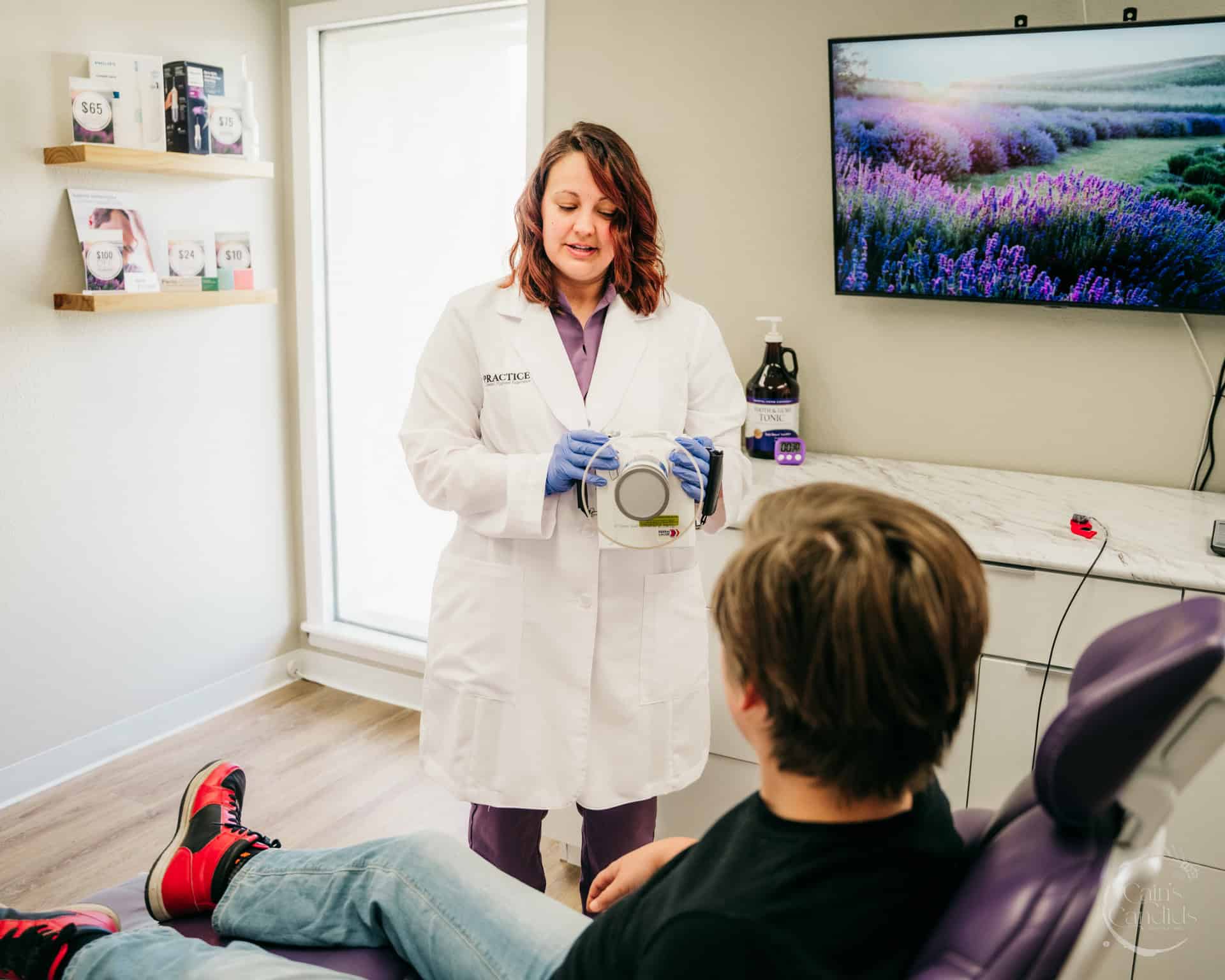 Family learning about dental hygiene in a dental office.