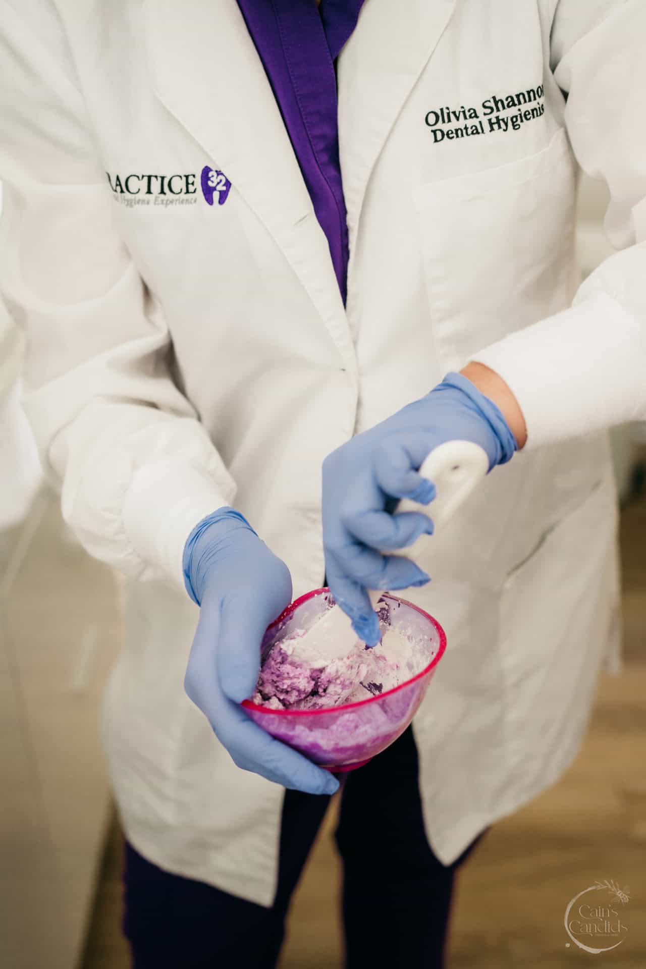 Colorful family dental hygiene calendar on a wall