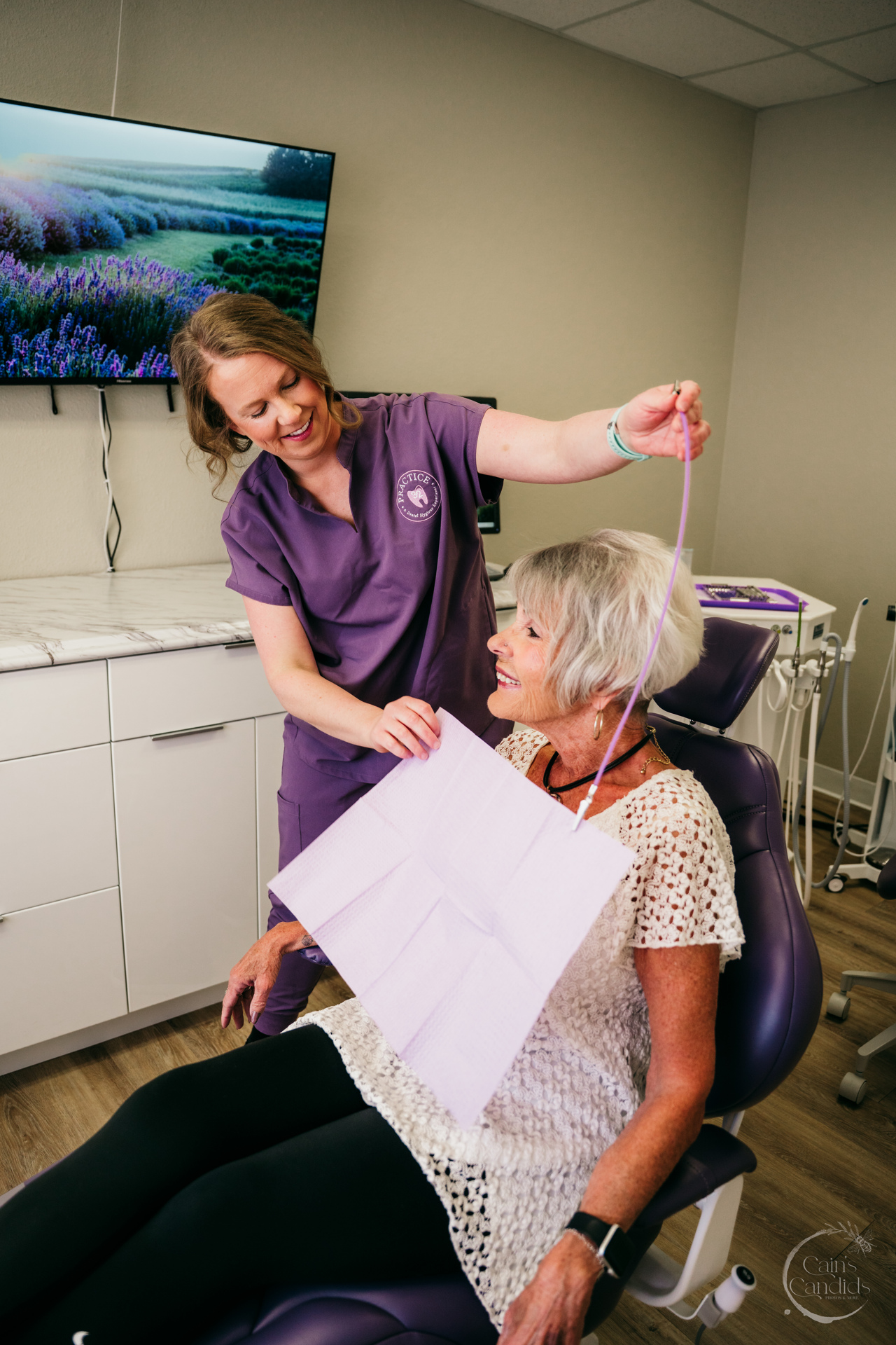 Colorful children's dental care products and a soft-bristled toothbrush on a bathroom counter.