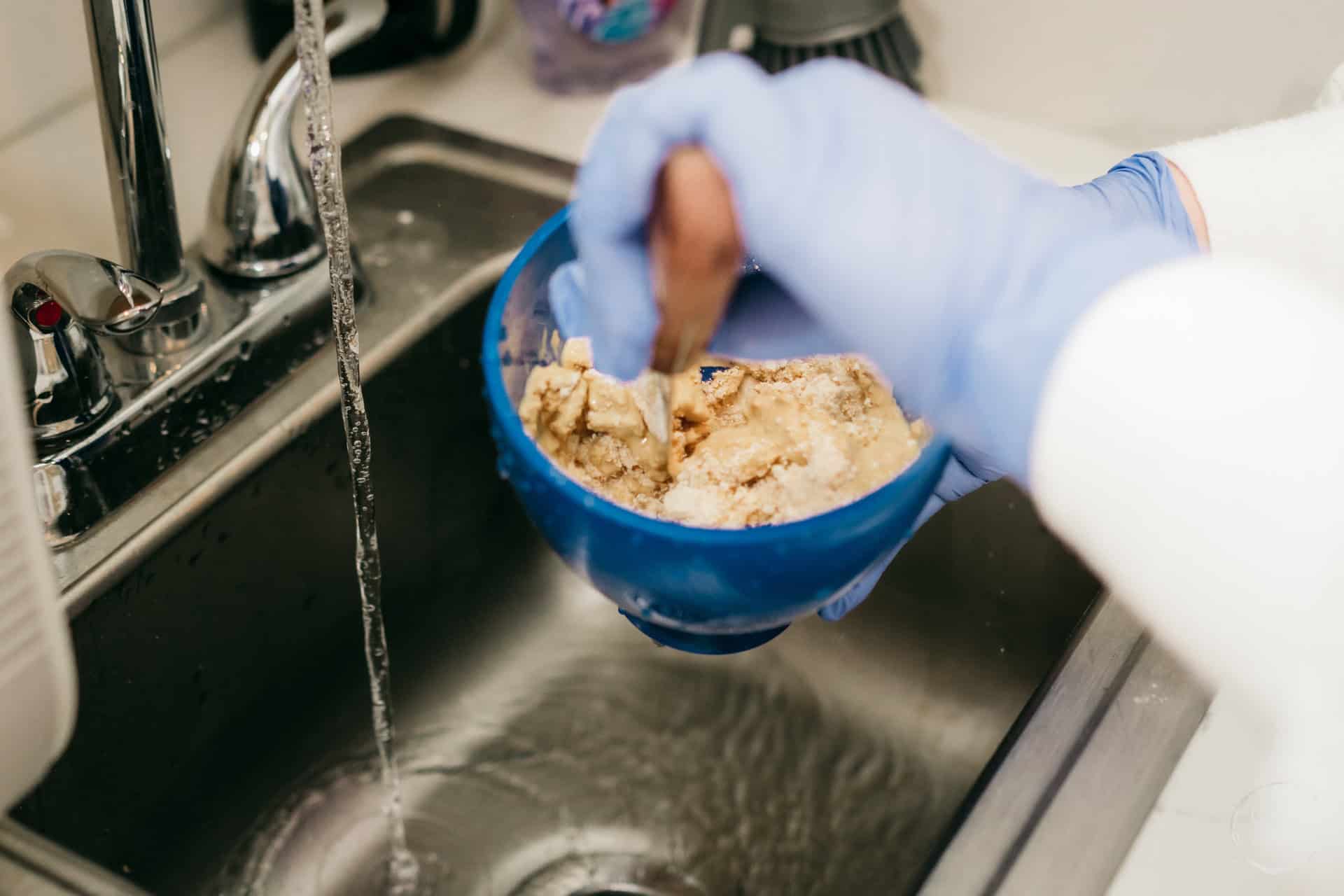 Dental hygienist reviewing patient health history