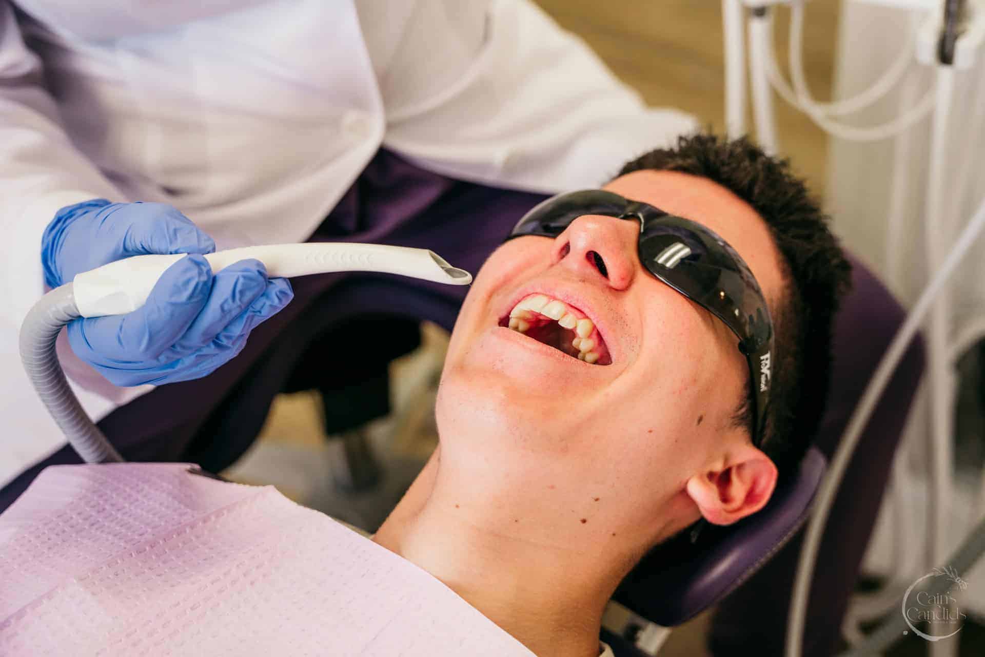A cozy dental office with educational materials in Spanish and English on the counter