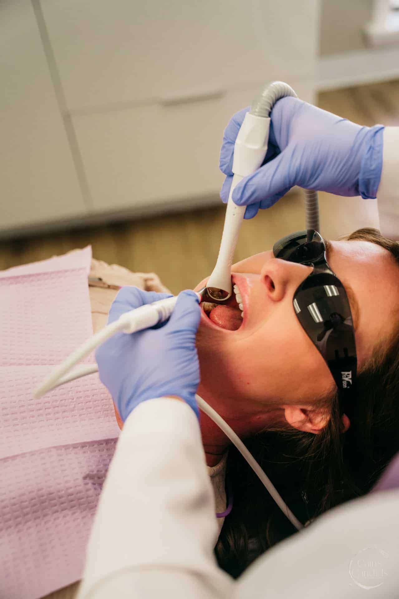 A family-friendly dental office with educational materials on oral hygiene displayed.