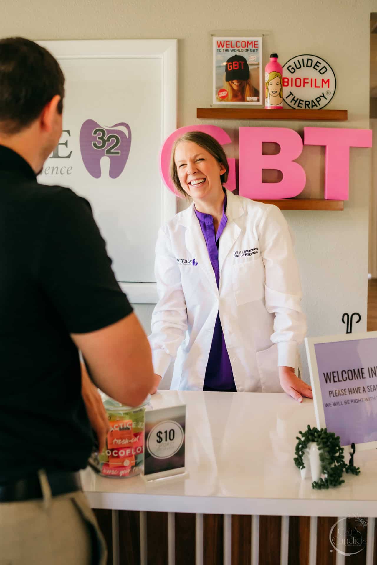 Close-up of dental tools and a water glass on a counter