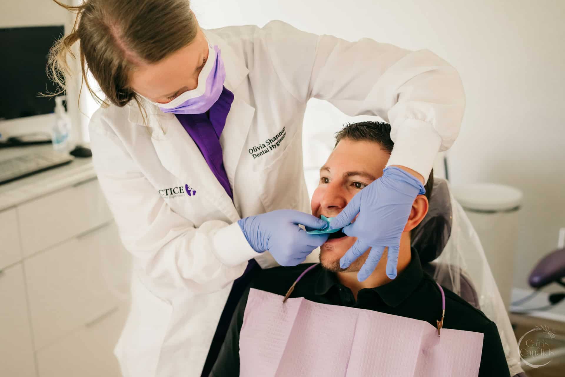 Dental tools beside a healthy set of teeth, symbolizing oral hygiene and healthcare.