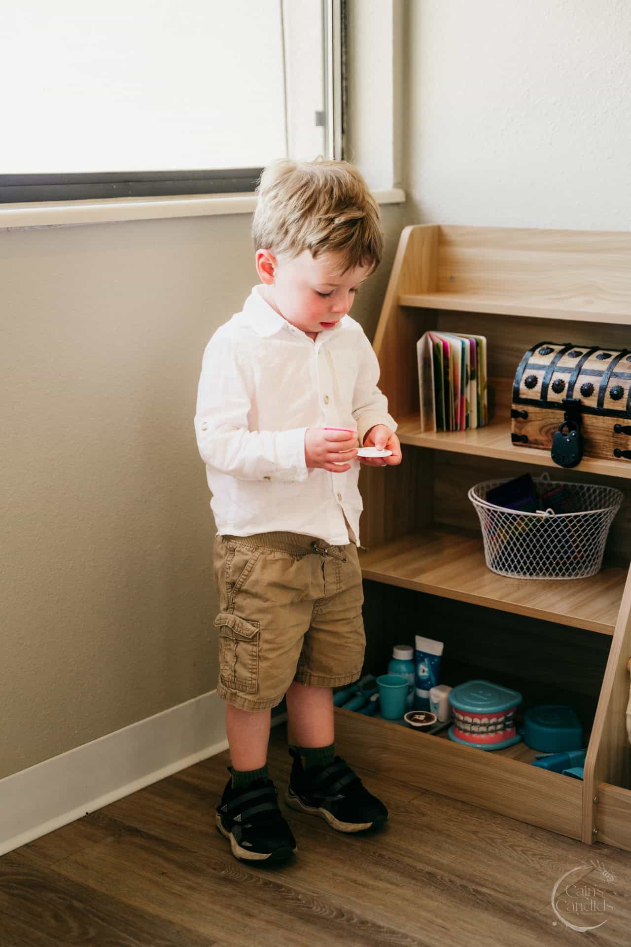 Dental hygienist providing free oral health check-up during a volunteer event.