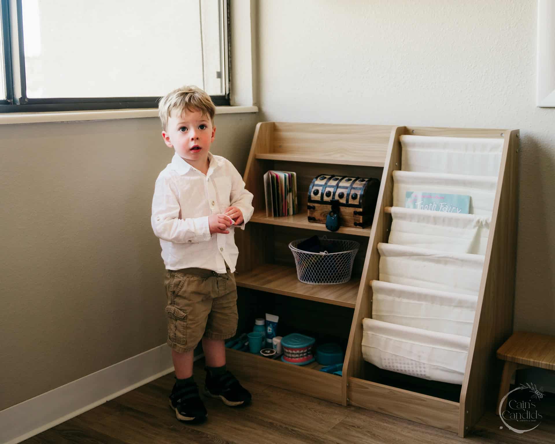A smiling individual holding a toothbrush, radiating positivity and good oral health.