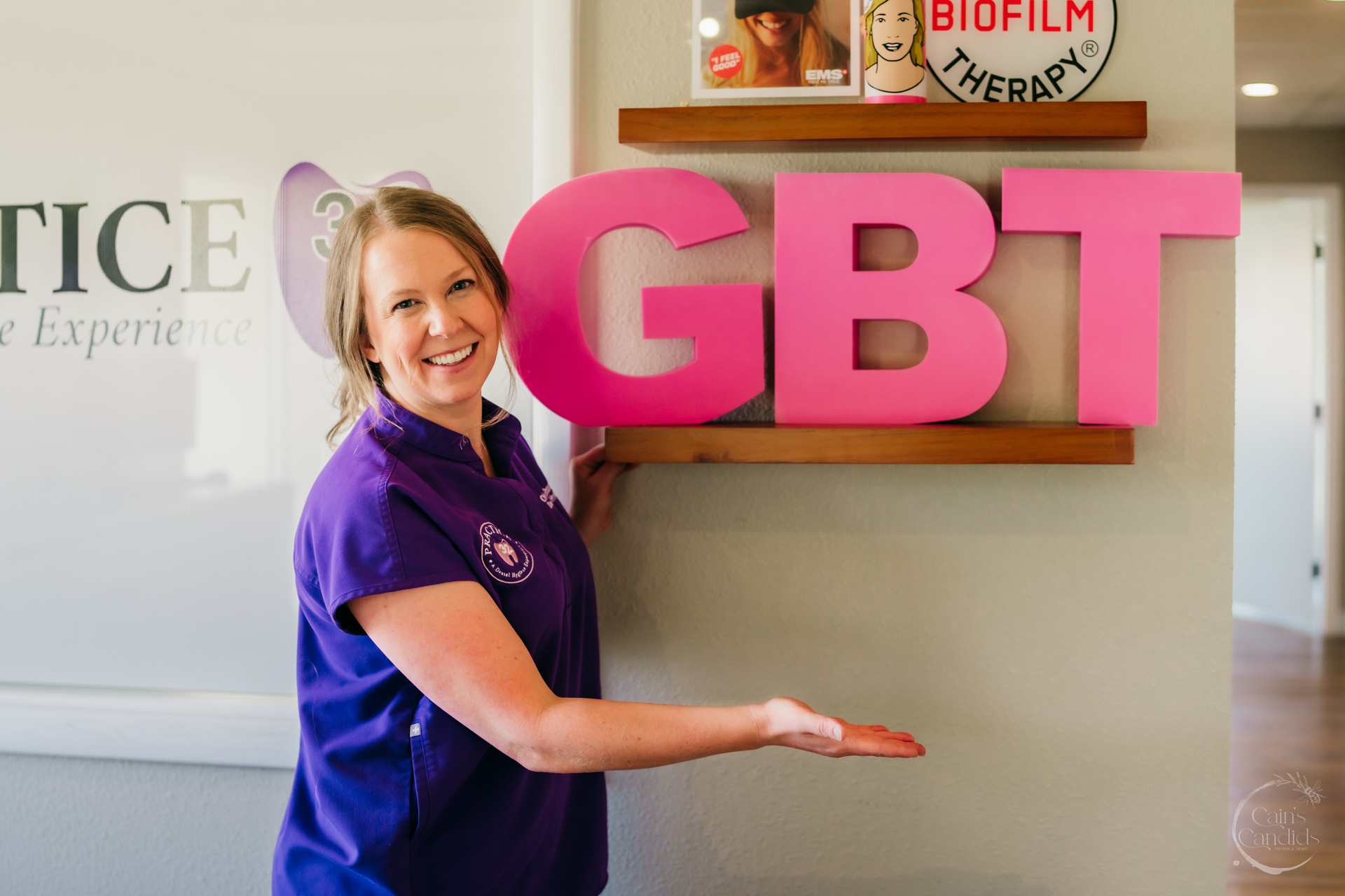 Smiling dental hygienist with patient in a dental chair