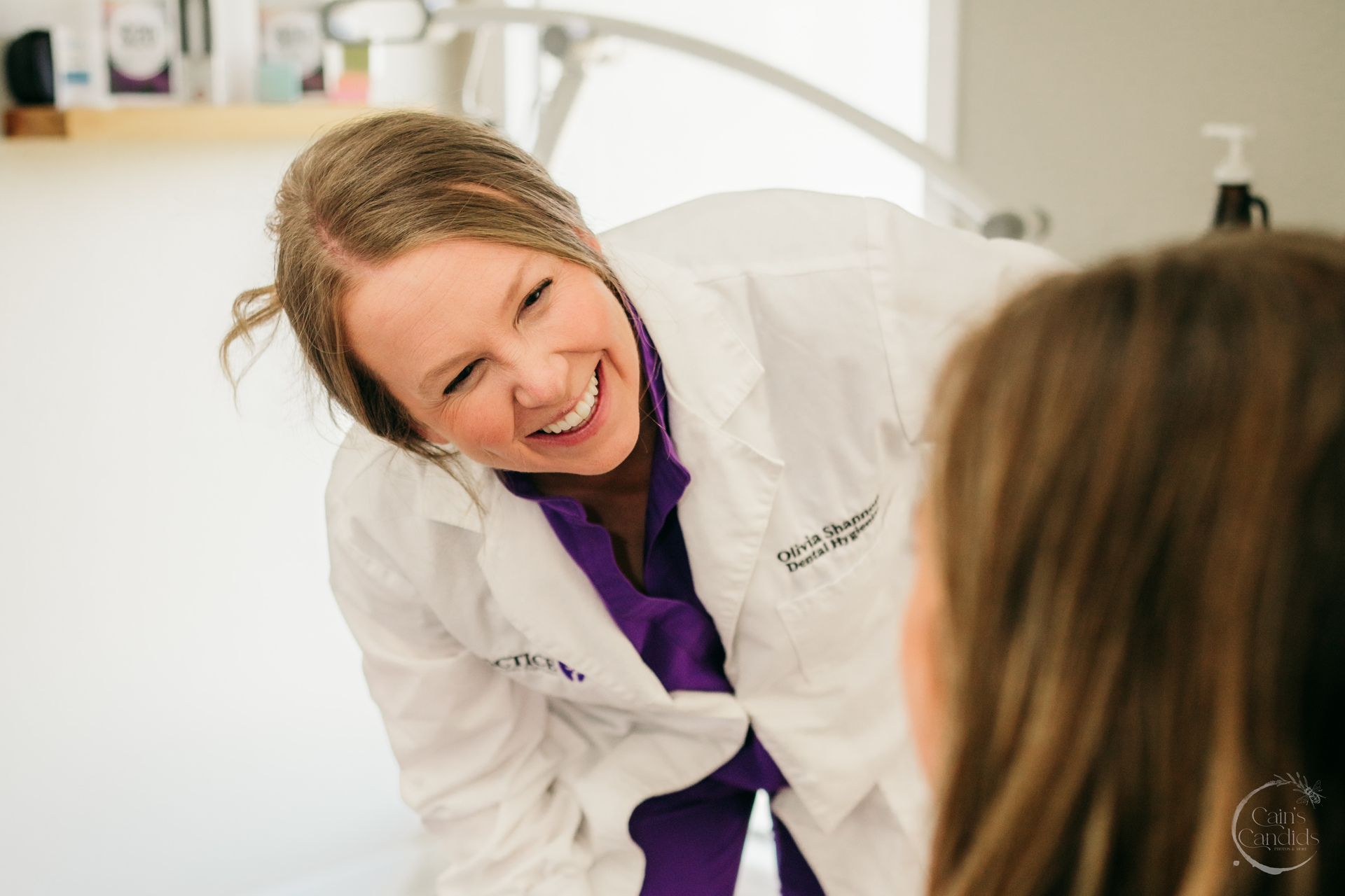 Dental hygienist using a dental endoscopy device on a patient at Practice 32.